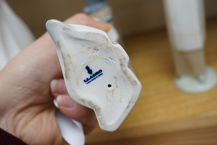 A Royal Doulton Images group and four LLadro figures